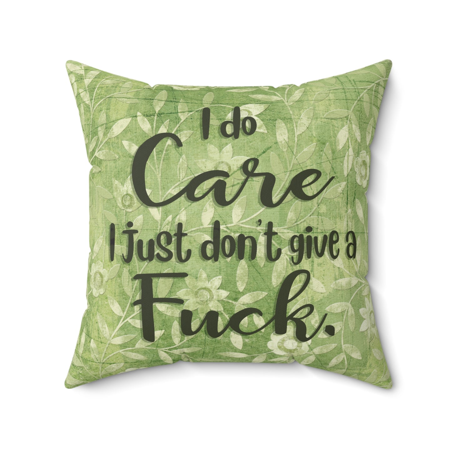 Sassy throw pillow that states: I don't give a Fuck pillow on green floral background