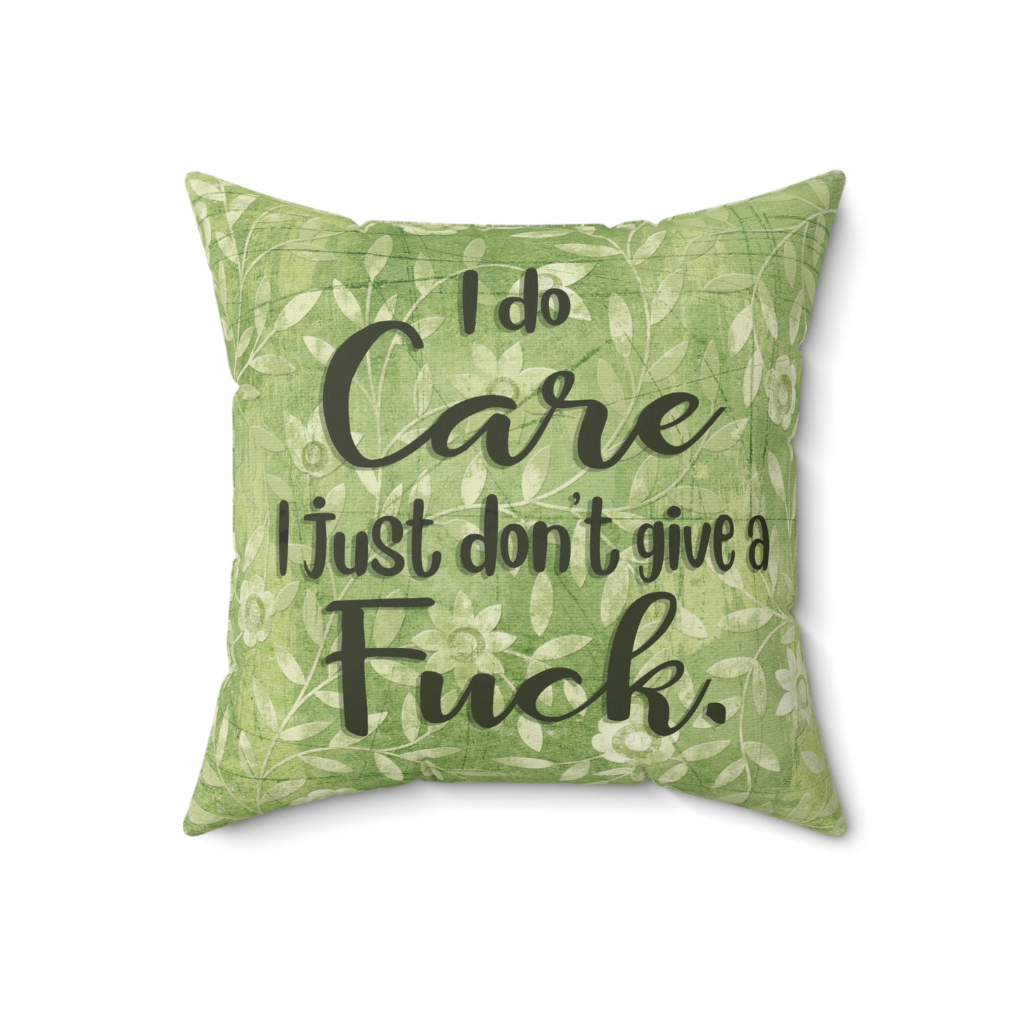 Sassy throw pillow that states: I don't give a Fuck pillow on green floral background