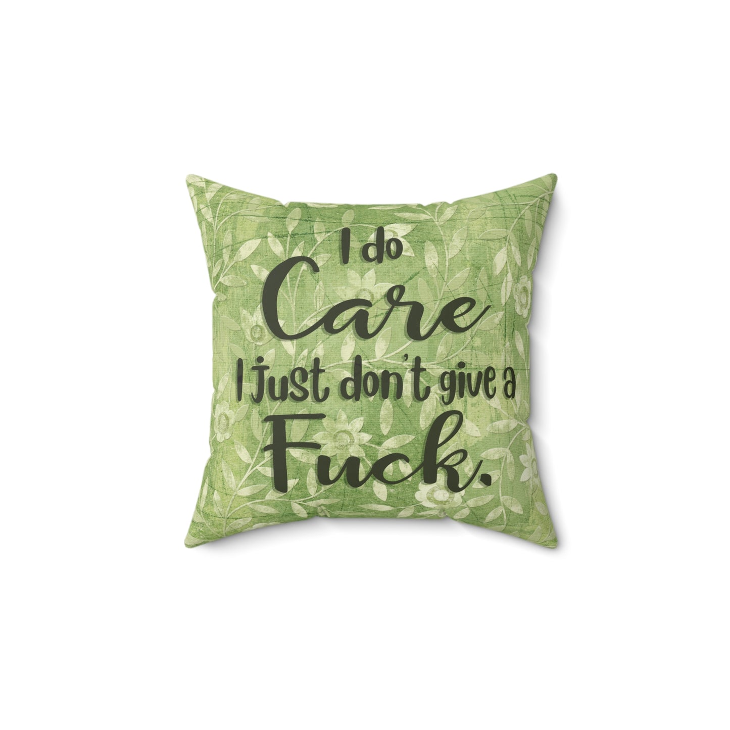 Sassy throw pillow that states: I don't give a Fuck pillow on green floral background